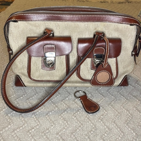 Dooney & Bourke Handbags - Dooney & Bourke Double Pocket Tote Purse in brown colored monogram.